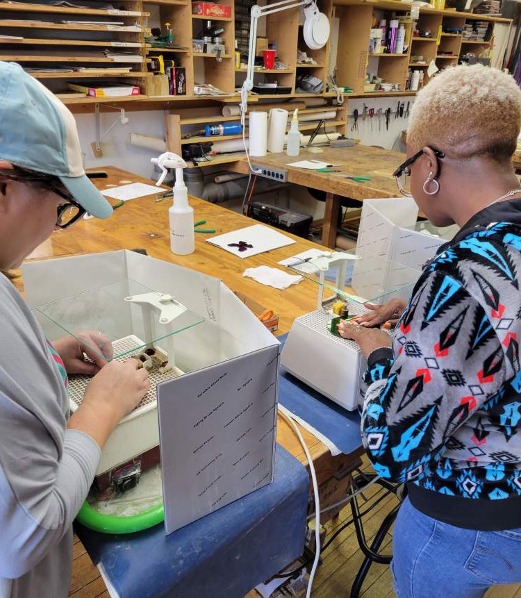 Students using the water grinders